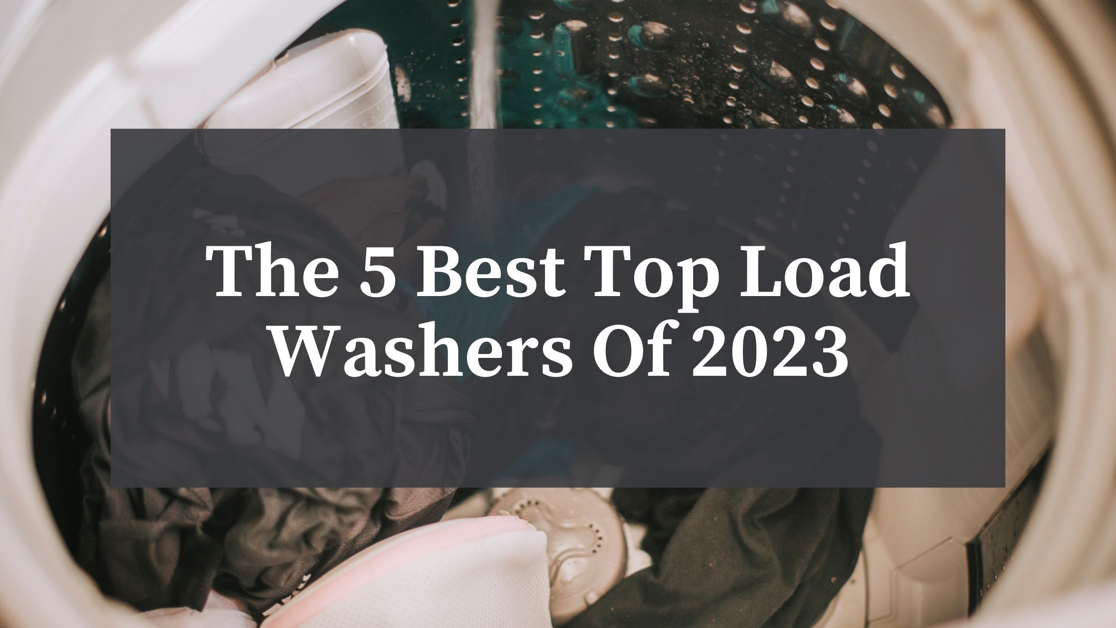 best top load washer in 2023 with clothes loaded in laundry room of a home