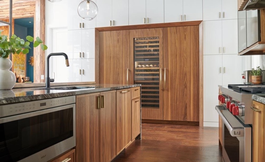 custom panel sub-zero fridge with wine cooler with wood grain cabinets in home kitchen