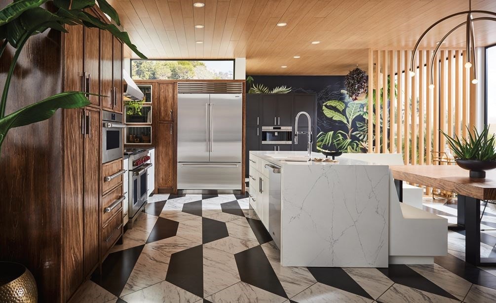 classic sub-zero stainless steel french door fridge in kitchen with black and white tile flooring