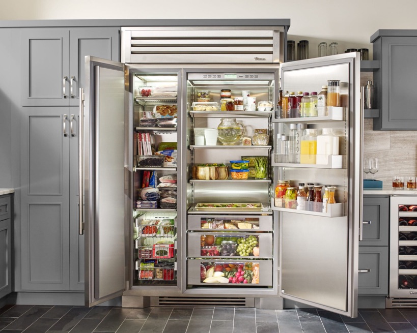 true refrigeration stainless steel open french doors with food in a home kitchen